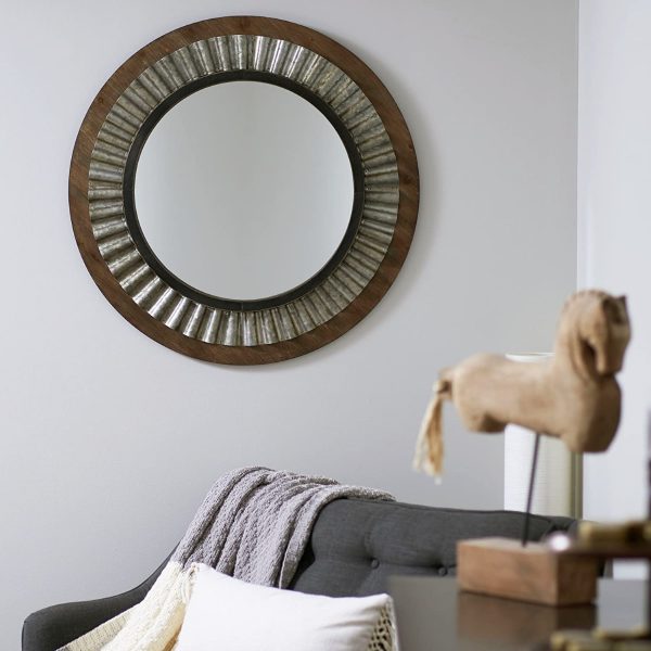 A stylish round wall mirror offers much more than plain functionality